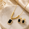 Noir Elegance Emerald-Cut Onyx & Gold Halo Pendant Set