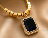 Noir Elegance Emerald-Cut Onyx & Gold Halo Pendant Set